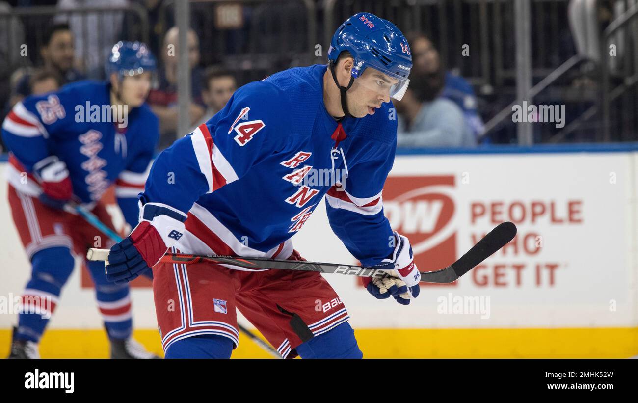 New York Rangers center Greg McKegg lines up for a faceoff during the