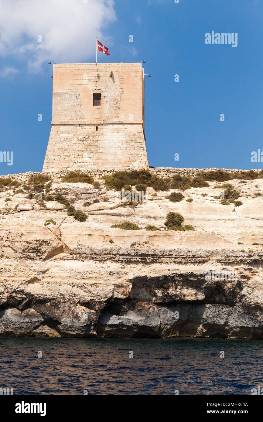 Mgarr ix-Xini Tower, the largest of the coastal watchtowers that the Knights of Malta erected on the island of Gozo. Maltese coastal landscape, vertic Stock Photo