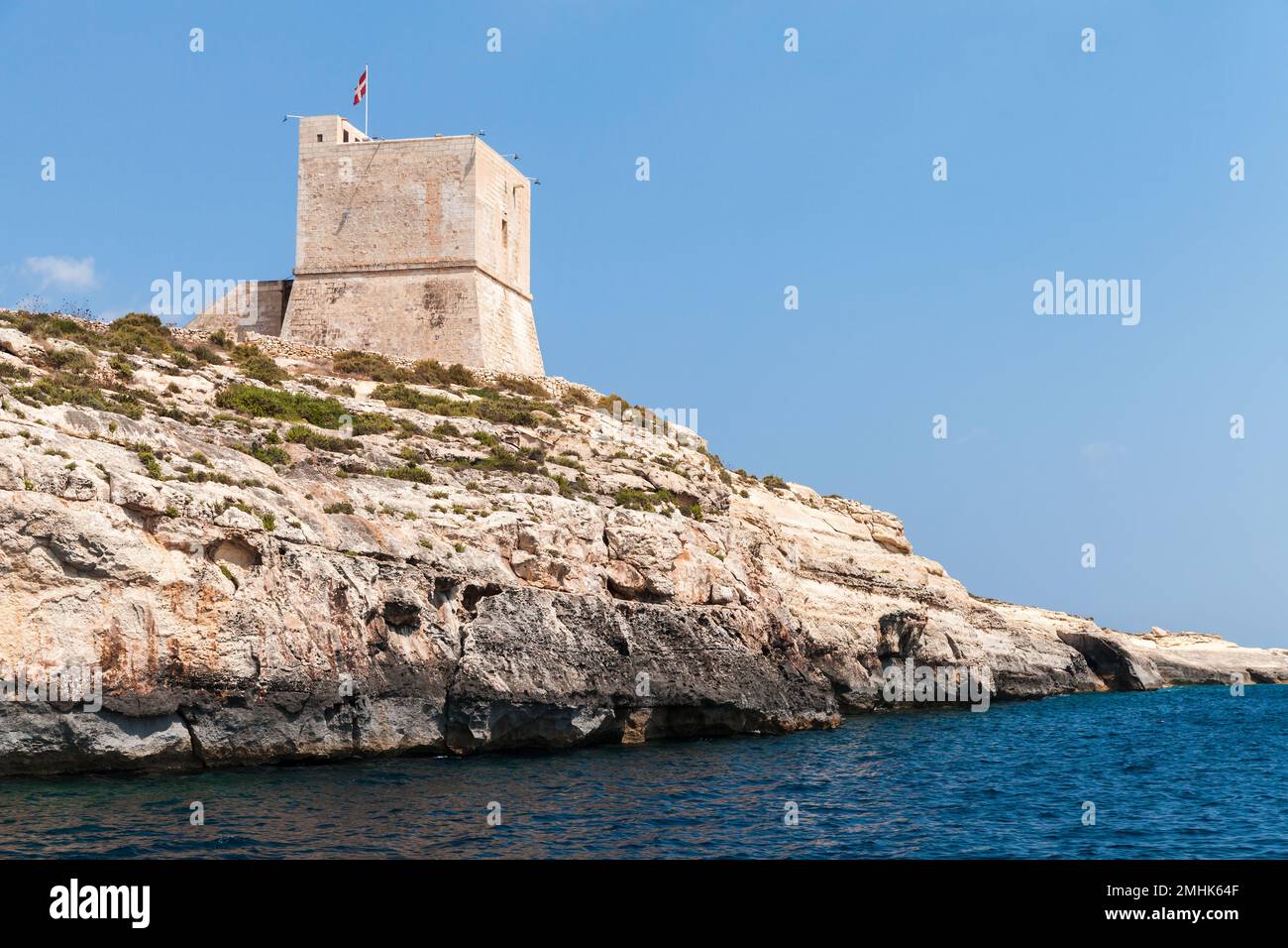 Maltese coastal landscape with Mgarr ix-Xini Tower, the largest of the coastal watchtowers that the Knights of Malta erected on the island of Gozo Stock Photo