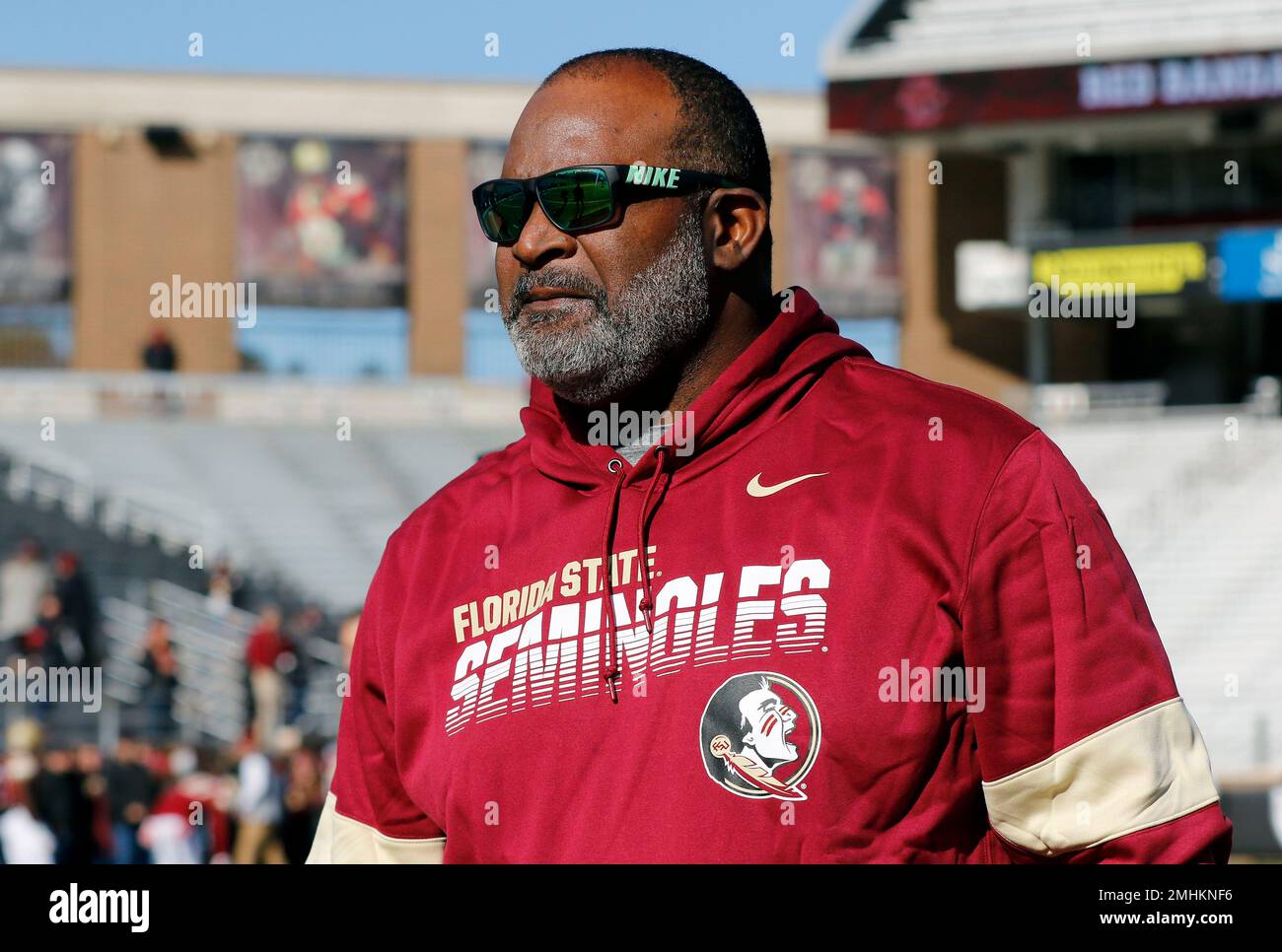 Florida State interim head coach Odell Haggins watches teams warm up