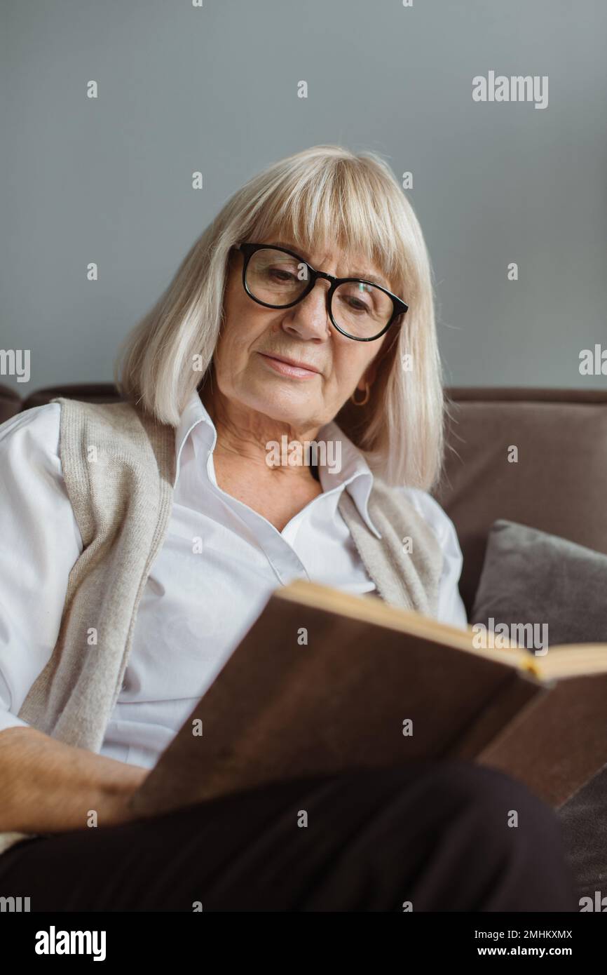 Old woman sitting alone sofa hi-res stock photography and images - Alamy