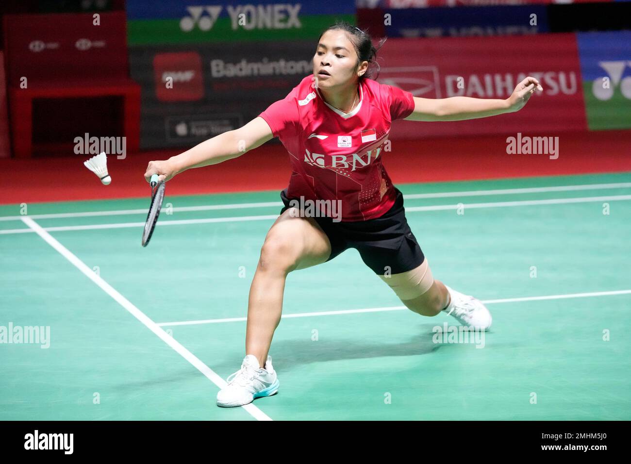 Indonesias Gregoria Mariska Tunjung return a shoot to Chinas Han Yue during the womens single match in the Indonesia Masters badminton tournament at the Istora Stadium in Jakarta, Indonesia, Friday, Jan