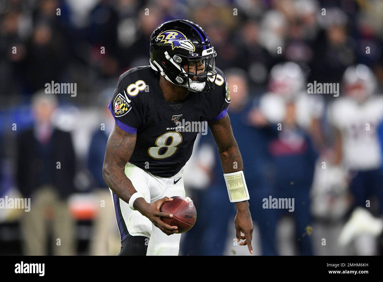 Baltimore Ravens quarterback Lamar Jackson (8) runs with the ball