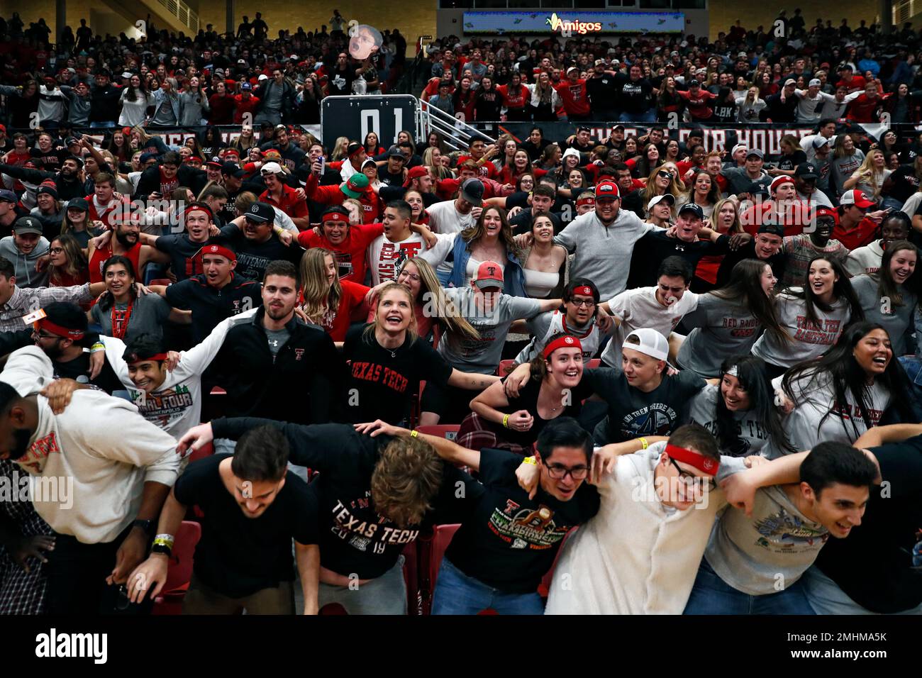 Texas Tech students sway back and forth during the first half of an