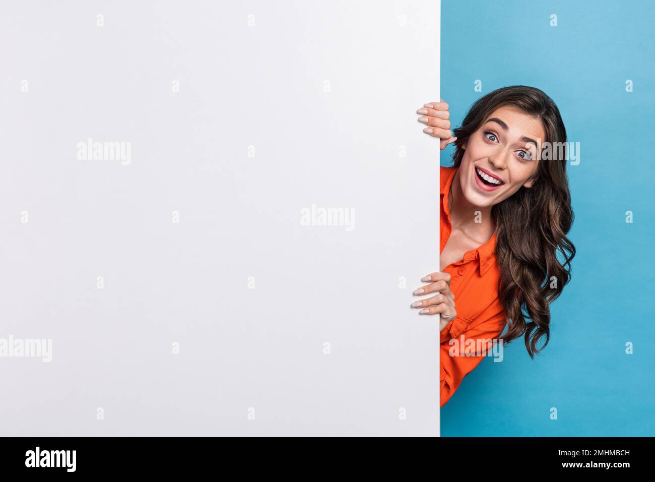 Young girl hiding behind wall hires stock photography and images Alamy