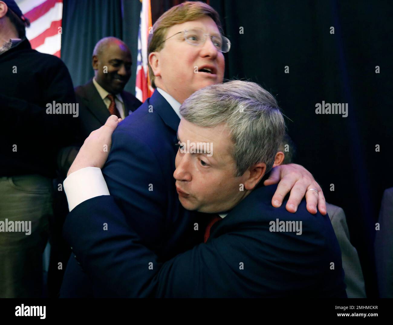 Republican Gov.-elect Tate Reeves, wearing glasses, congratulates ...