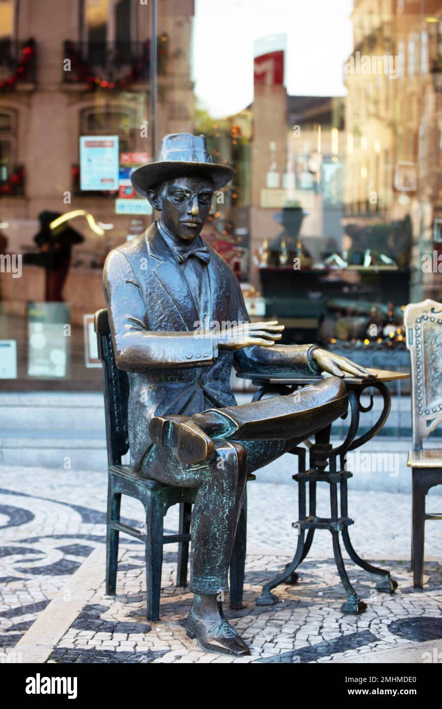 Bronze statue portraits of the poet Fernando Pessoa in Lisbon Portugal