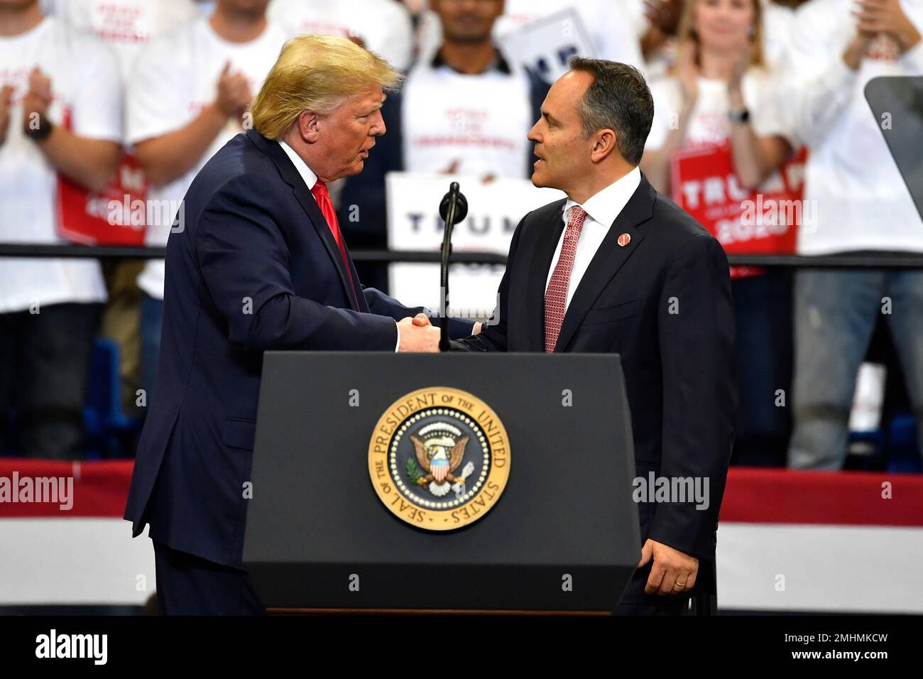 President Donald Trump, left, shakes hands with Kentucky Gov. Matt ...