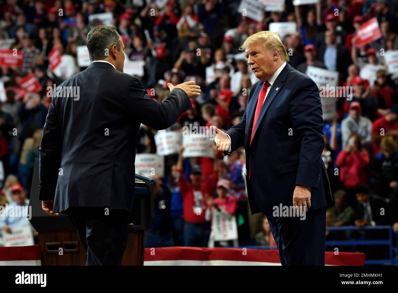 President Donald Trump, left, greets Kentucky Gov. Matt Bevin, right ...