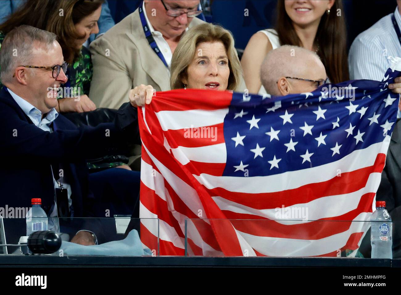 The U.S. ambassador to Australia Caroline Kennedy holds up her national