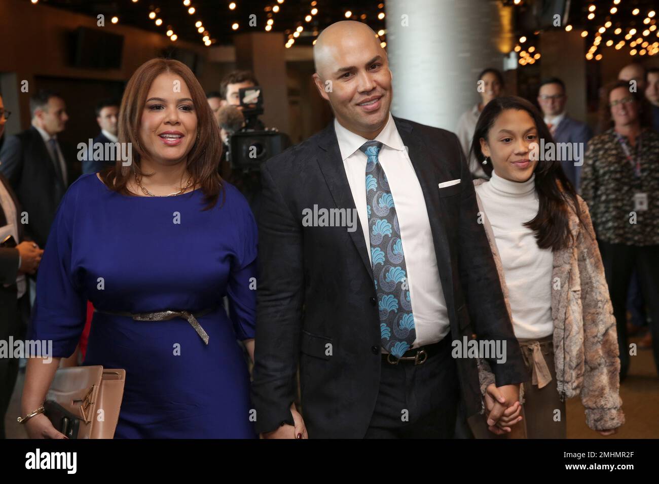 New York Mets new manager Carlos Beltran arrives at an introductory  baseball news conference with his family, including his wife Jessica Beltran,  left, at Citi Field, Monday, Nov. 4, 2019, in New