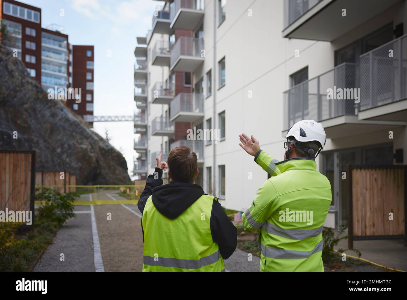 Constructions workers in residential area Stock Photo