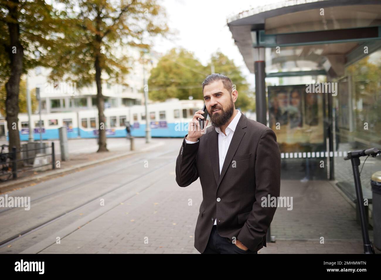 Businessman talking via cell phone Stock Photo