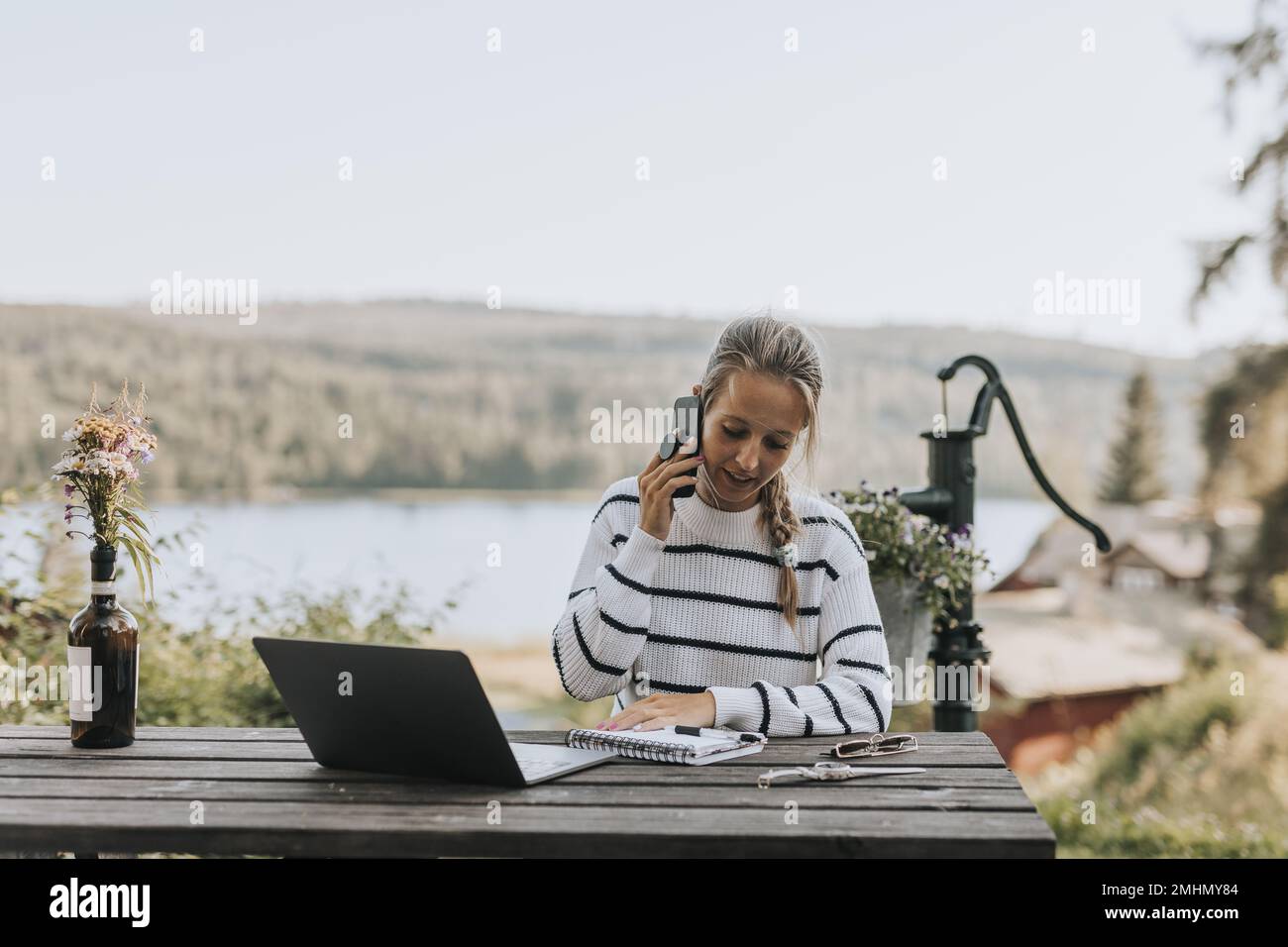 Young woman taking via cell phone Stock Photo