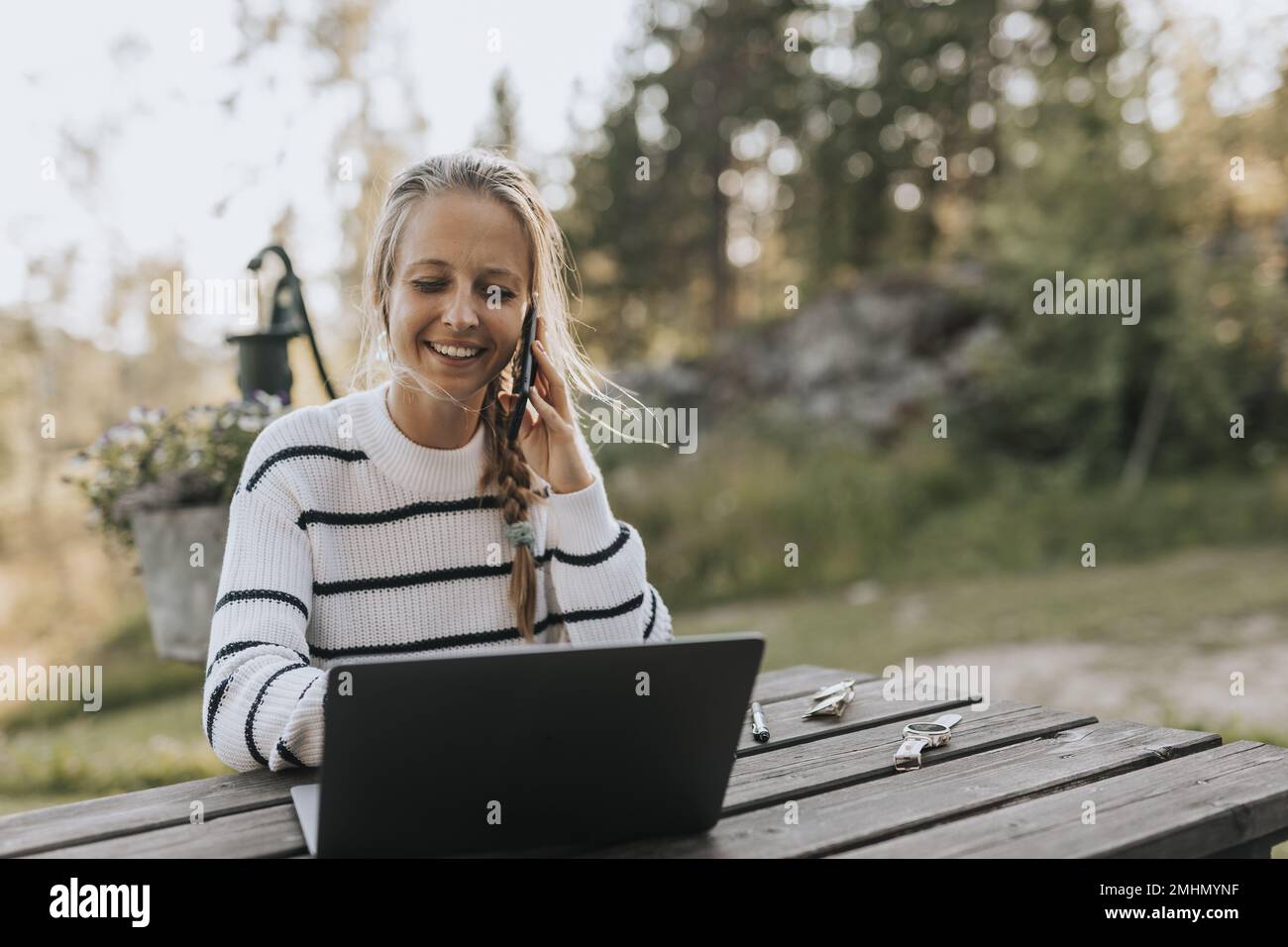 Young woman taking via cell phone Stock Photo