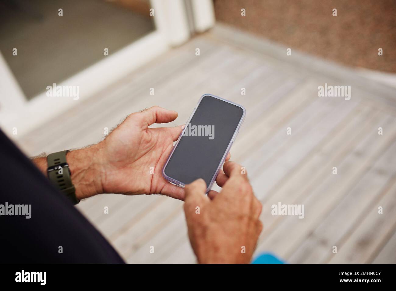 Hands holding cell phone Stock Photo