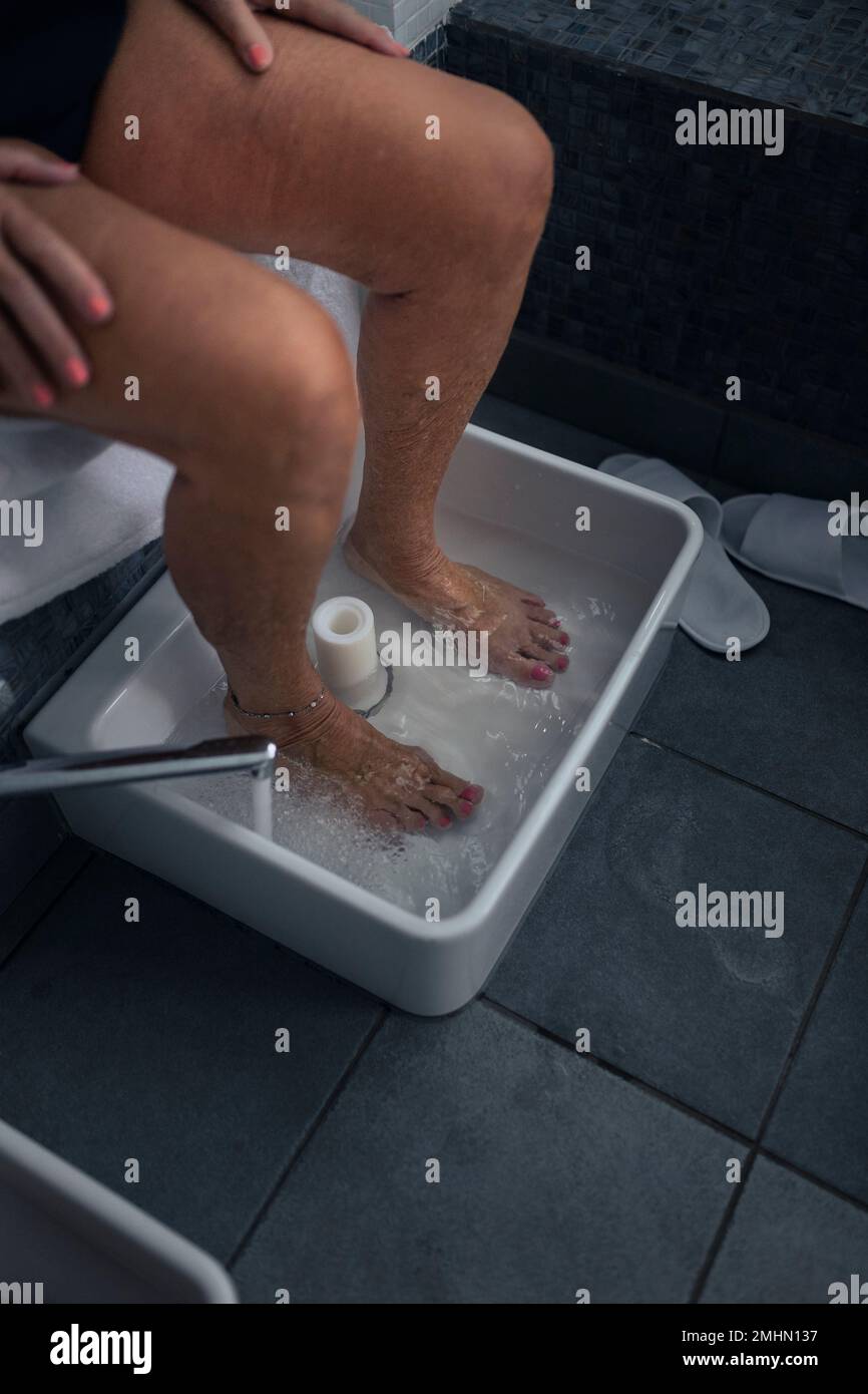 Woman having footbath Stock Photo