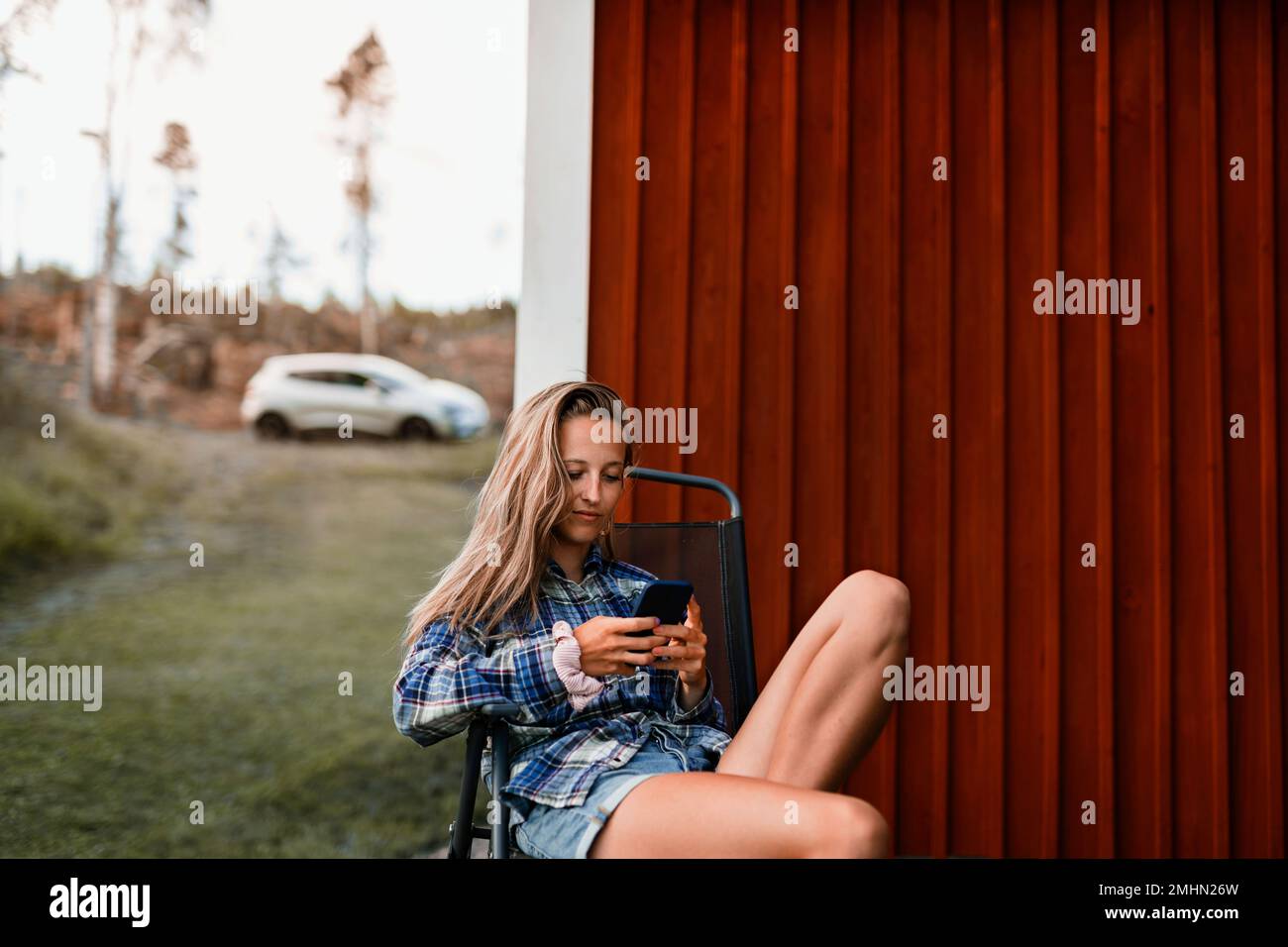 Young woman using cell phone Stock Photo
