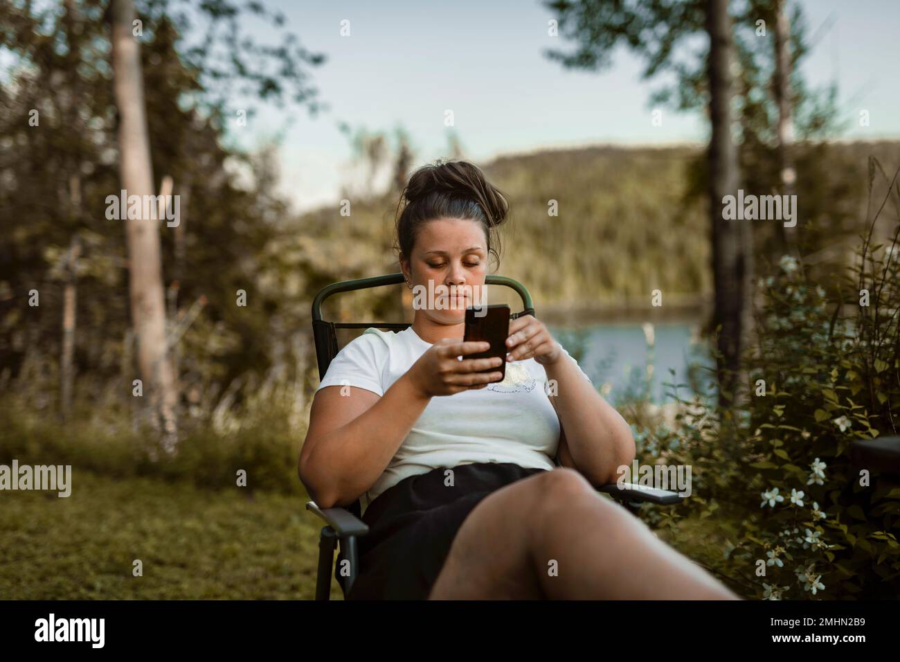 Young woman using cell phone Stock Photo