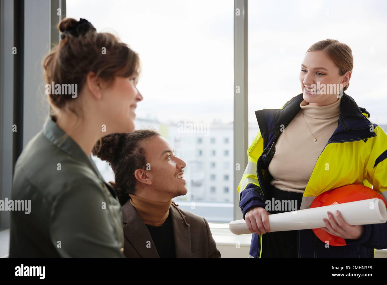 Smiling people having meeting in office Stock Photo
