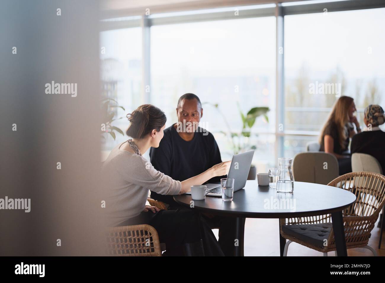 People talking in cafeteria Stock Photo