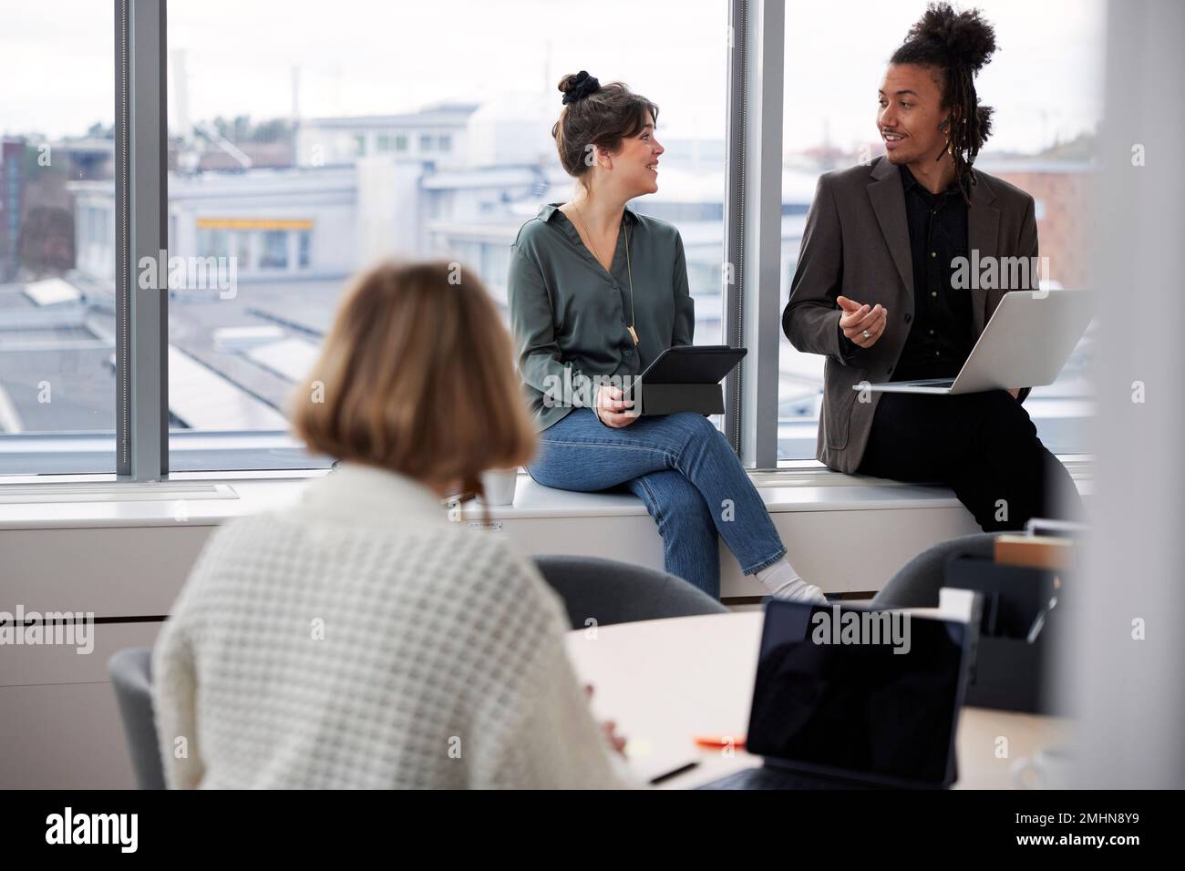 Business people working on laptops in office Stock Photo