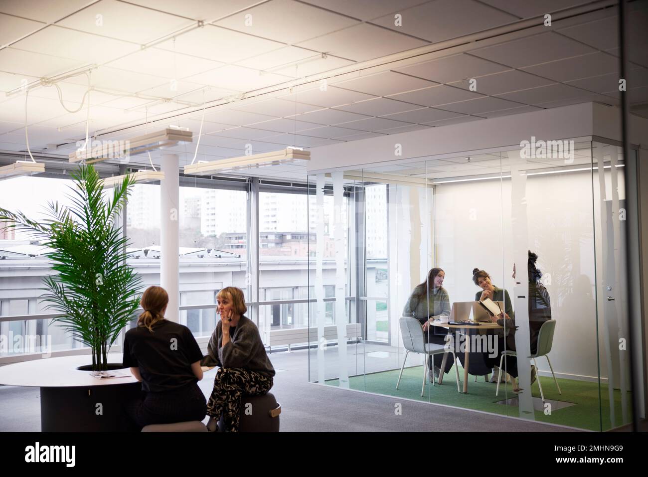 Business people having meetings in office Stock Photo - Alamy
