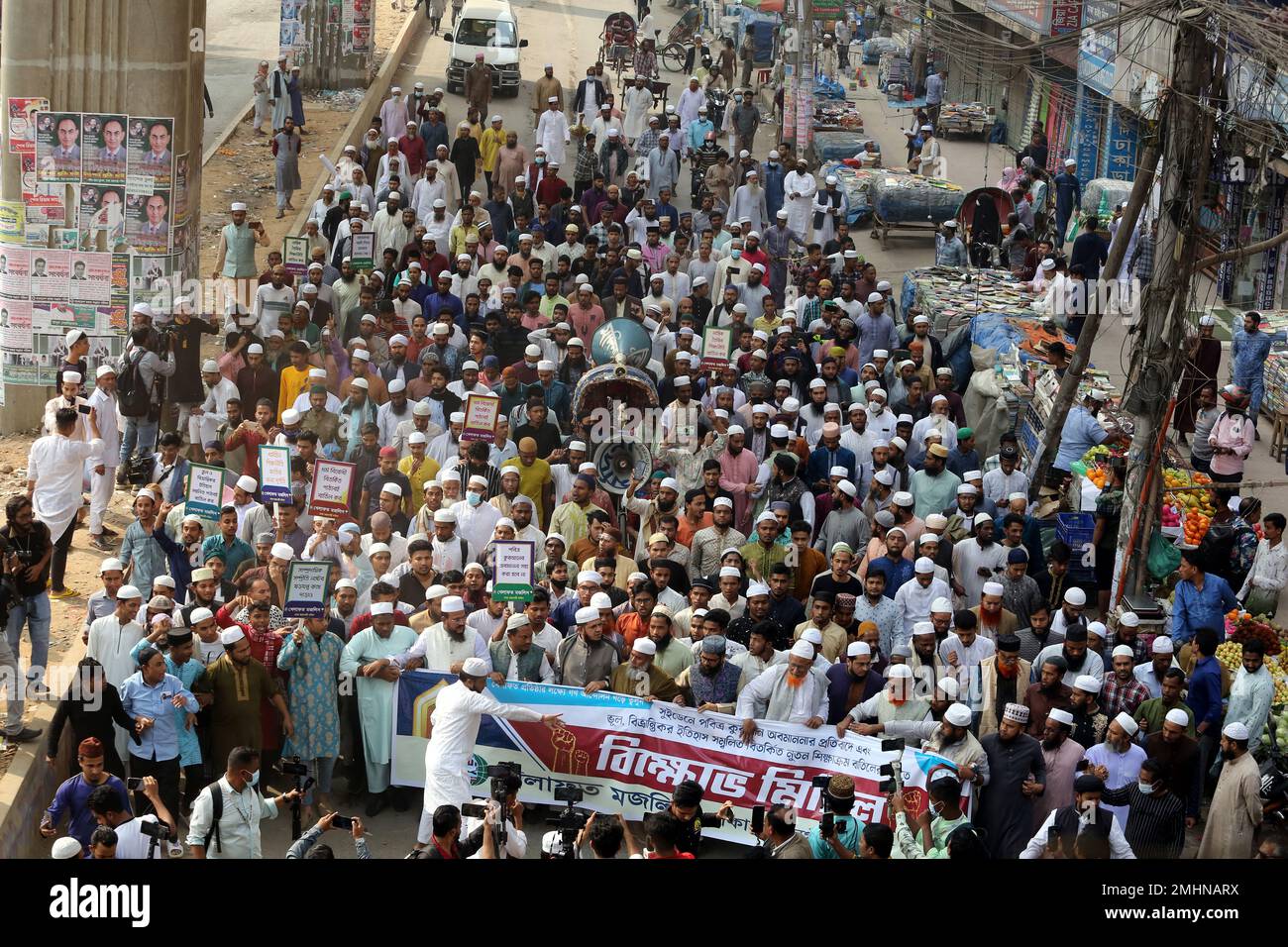 Activists of the Khilafat Majlish, an Islamic political group, stage a protest against the burning of the Koran by Swedish-Danish far-right politician Rasmus Paludan and to scrap the latest changes in textbooks prepared by the countrys National Curriculum and Textbook Board (NCTB), in front of the Baitul Muqarram mosque in Dhaka . January 27, 2023, in Dhaka, Bangladesh. Photo by Habibur Rahman/ABACAPRESS.COM Credit: Abaca Press/Alamy Live News Stock Photo