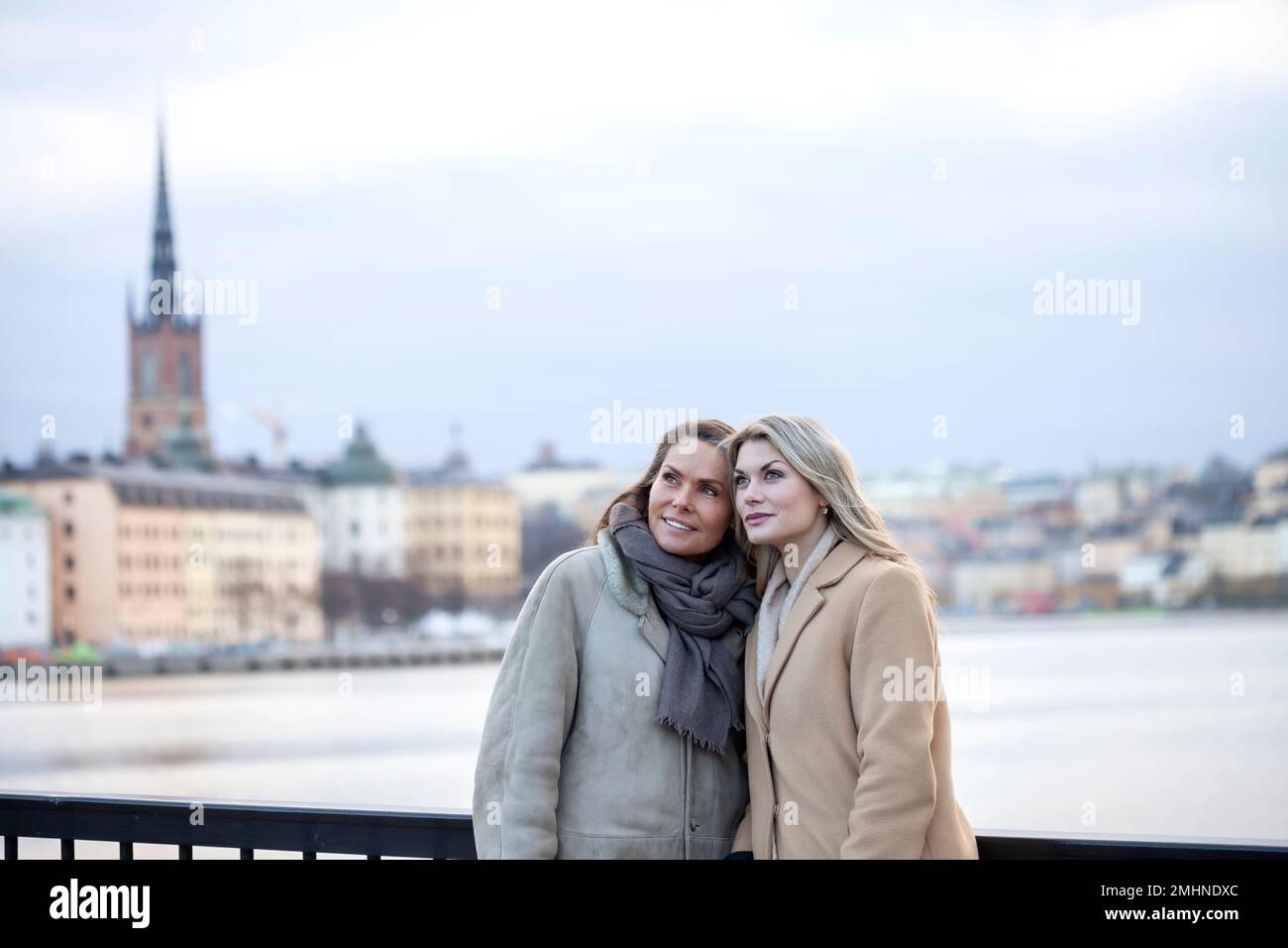 Mother with adult daughter in urban setting Stock Photo