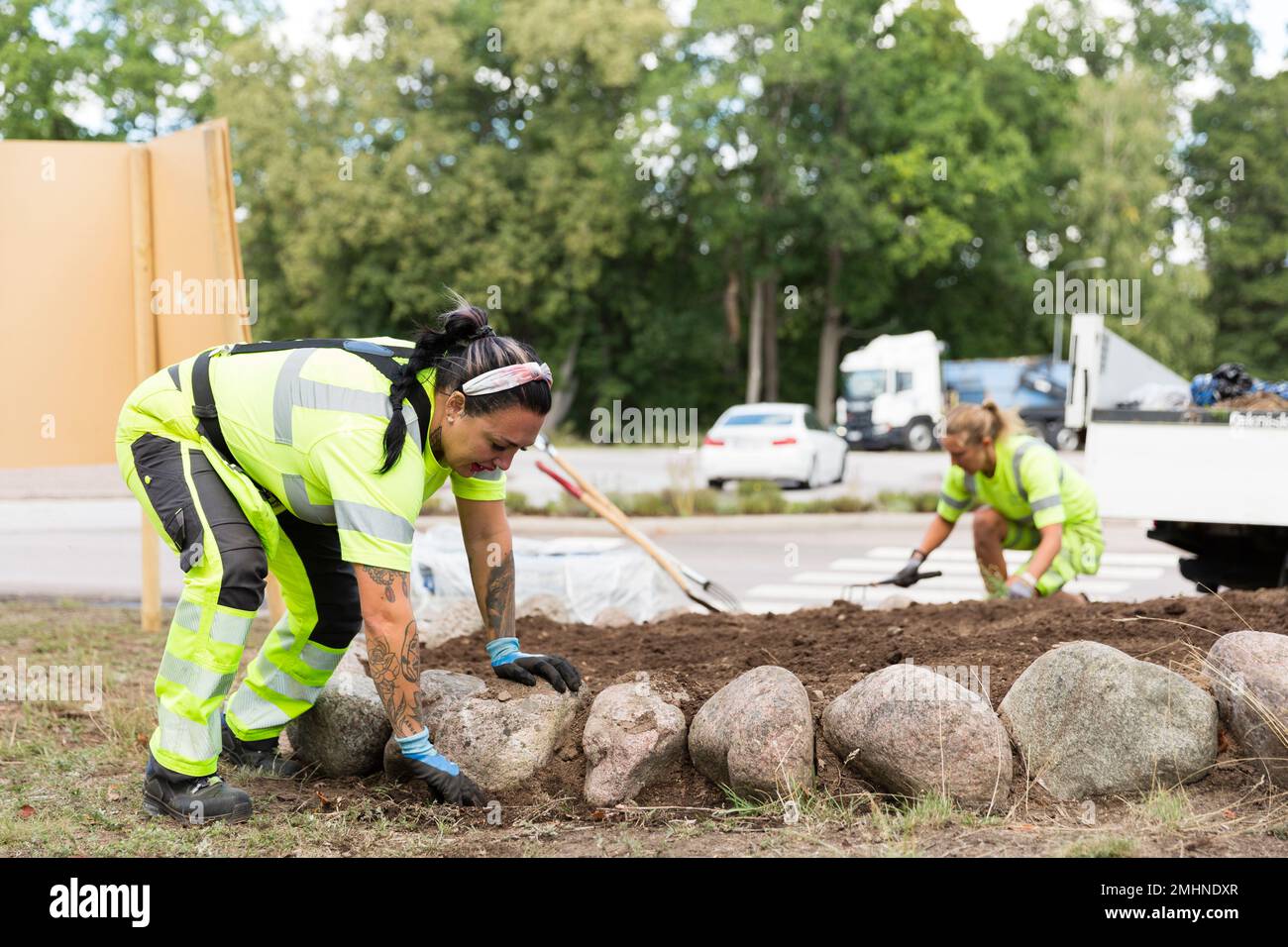 Female workers doing landscaping work Stock Photo - Alamy