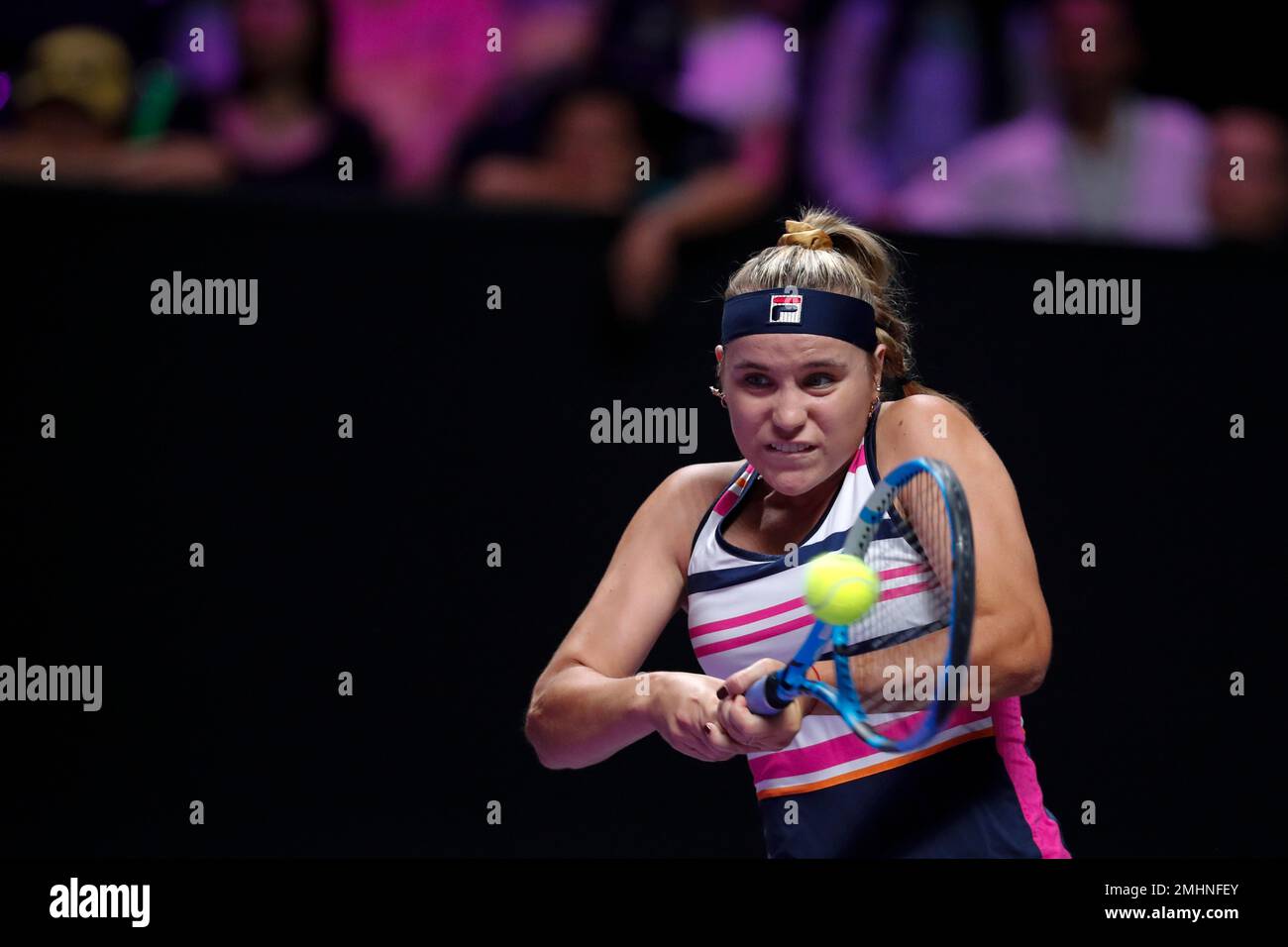 Sofia Kenin of the United States hits a return shot against Elina