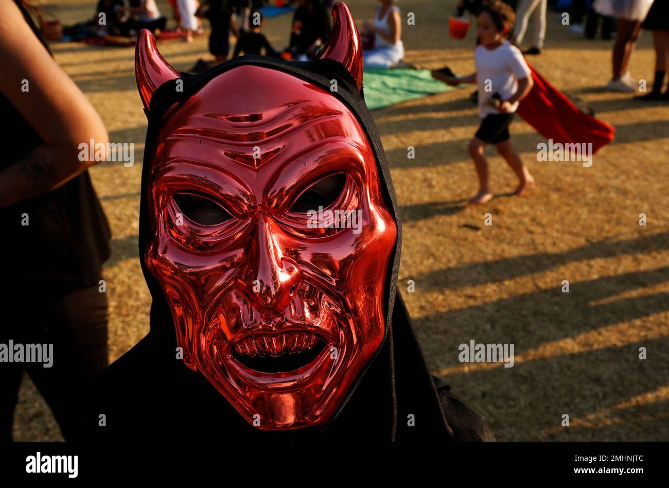 A reveller wears a satanic mask during celebrations to mark Halloween