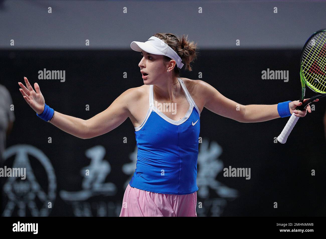 Belinda Bencic of Switzerland reacts after winning a set point against Kiki  Bertens of the Netherlands during the WTA Finals Tennis Tournament at the  Shenzhen Bay Sports Center in Shenzhen, China's Guangdong
