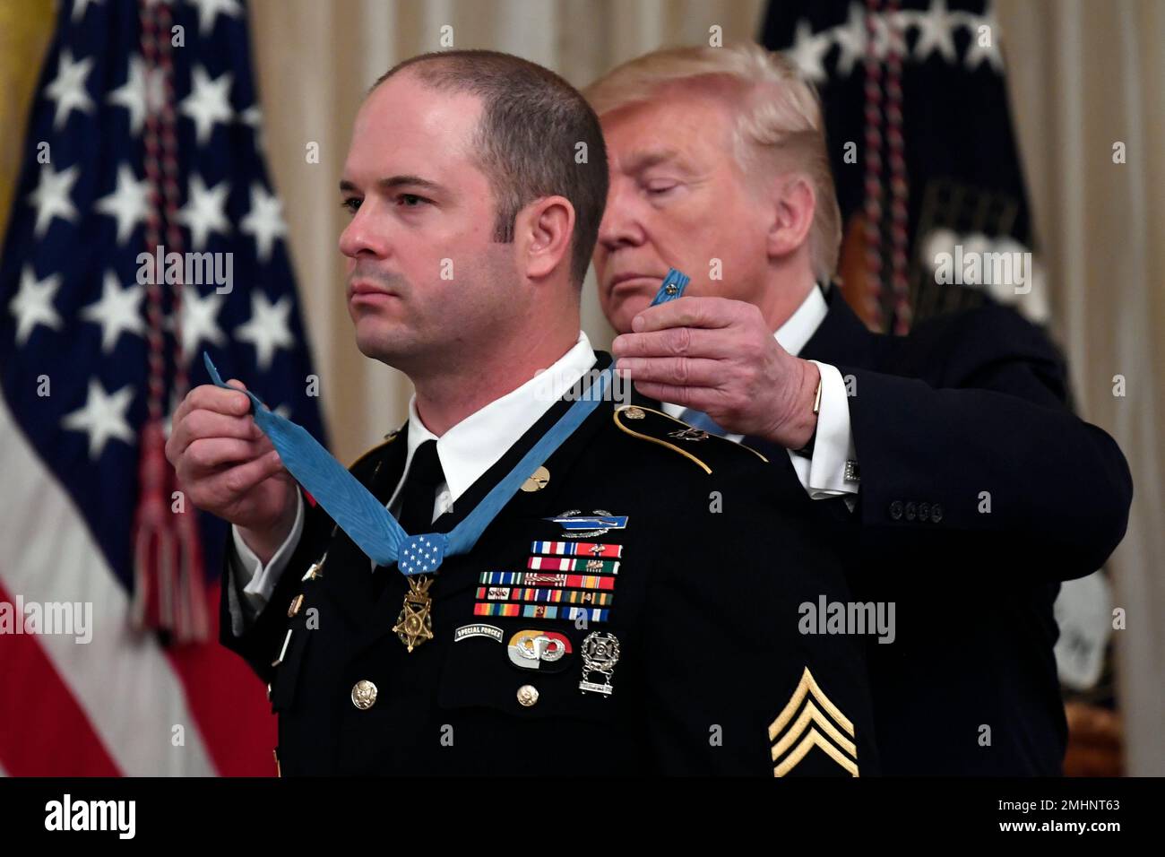 President Donald Trump, right, presents Army Master Sgt. Matthew ...