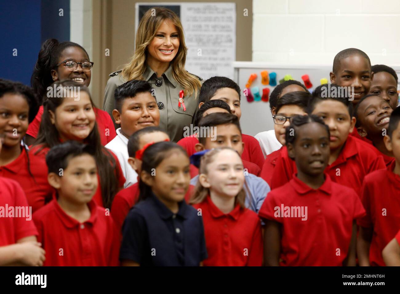 First lady Melania Trump poses for a group photo with students at Lambs