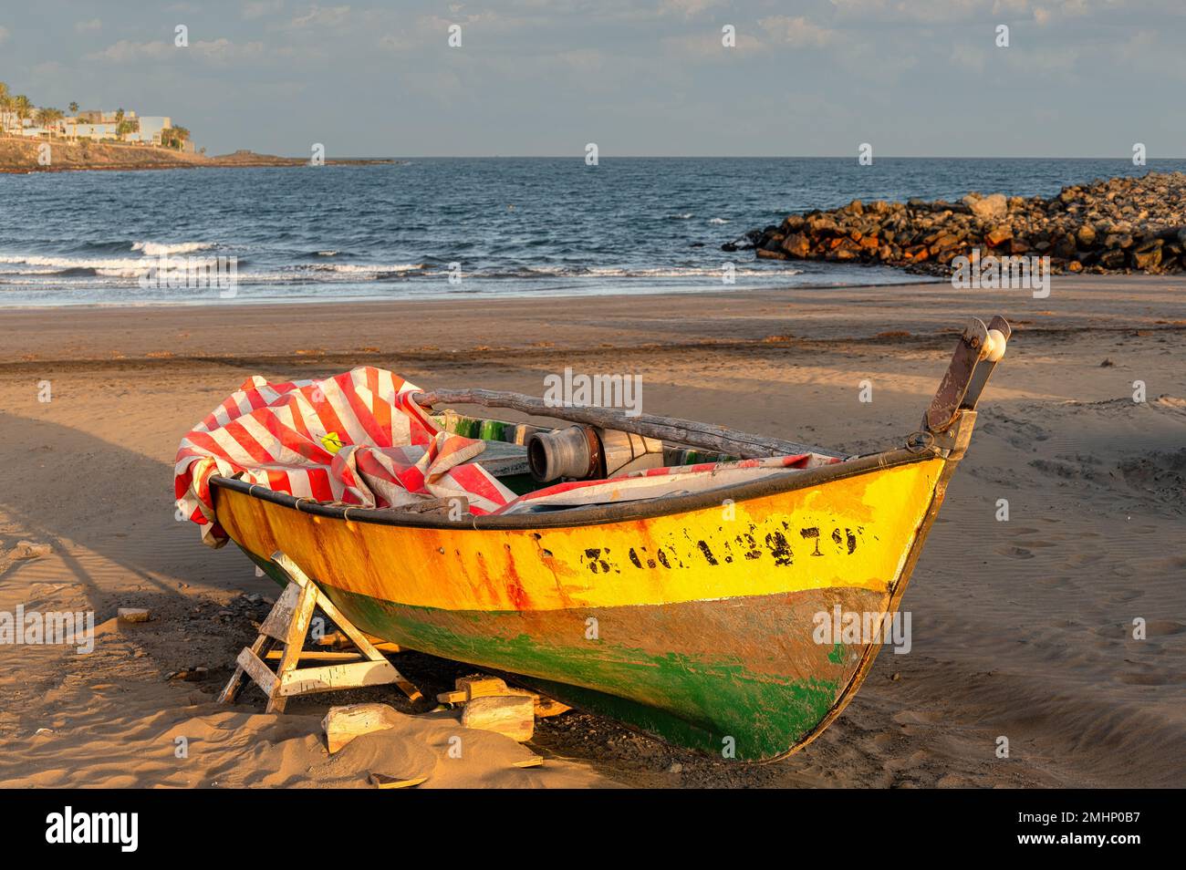 old fishing boat stands on the beach Stock Photo - Alamy
