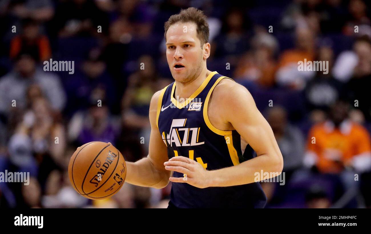 Utah Jazz forward Bojan Bogdanovic, left, loses the ball under pressure  from Houston Rockets forward Jae'Sean Tate (8) during the first half of an NBA  basketball game Wednesday, April 21, 2021, in