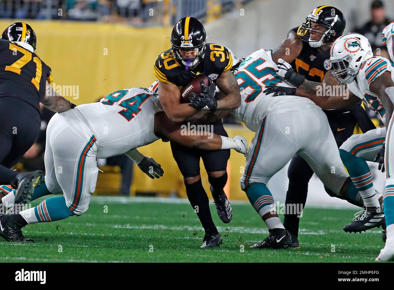 Miami Dolphins defensive tackle Christian Wilkins (94) tackles Buffalo  Bills tight end Dawson Knox (88) during the second half of an NFL football  game, Sunday, Sept. 25, 2022, in Miami Gardens, Fla. (