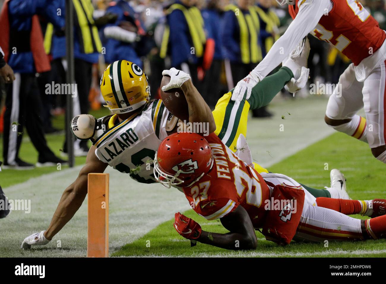 Green Bay Packers wide receiver Allen Lazard (13) is tackled by Kansas City  Chiefs cornerback Rashad Fenton (27) before he entered the end zone, during  the first half of an NFL football