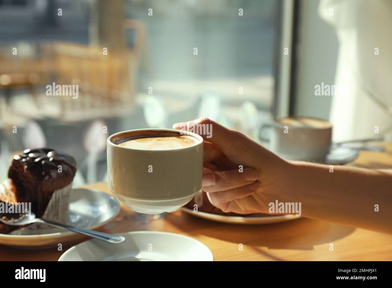 Portrait of a sensual, nude woman holding an aromatic cup of coffee Stock  Photo - Alamy