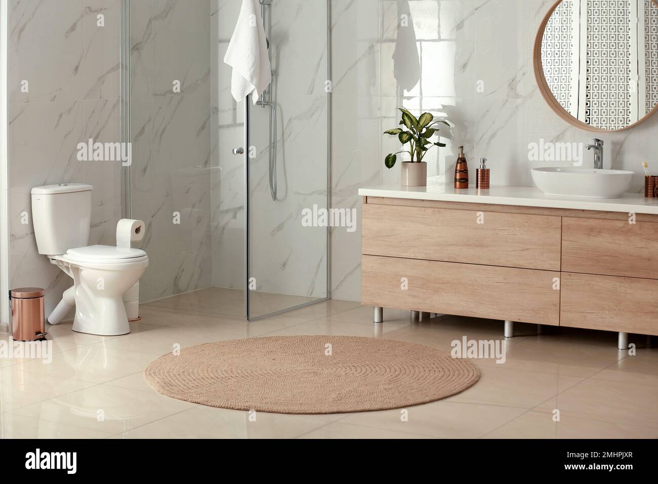 Interior of modern bathroom with toilet bowl Stock Photo - Alamy