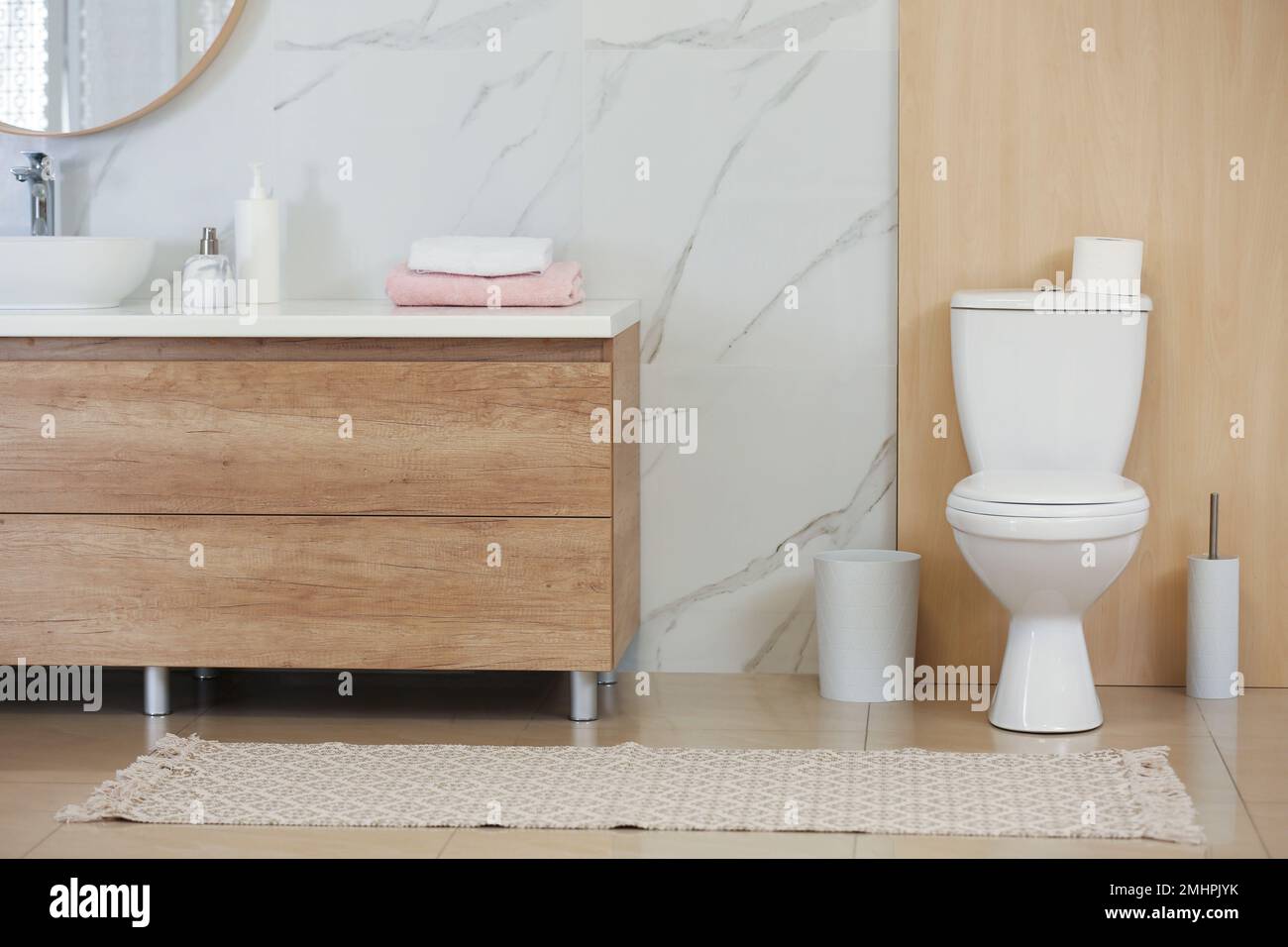 Interior of modern bathroom with toilet bowl Stock Photo - Alamy