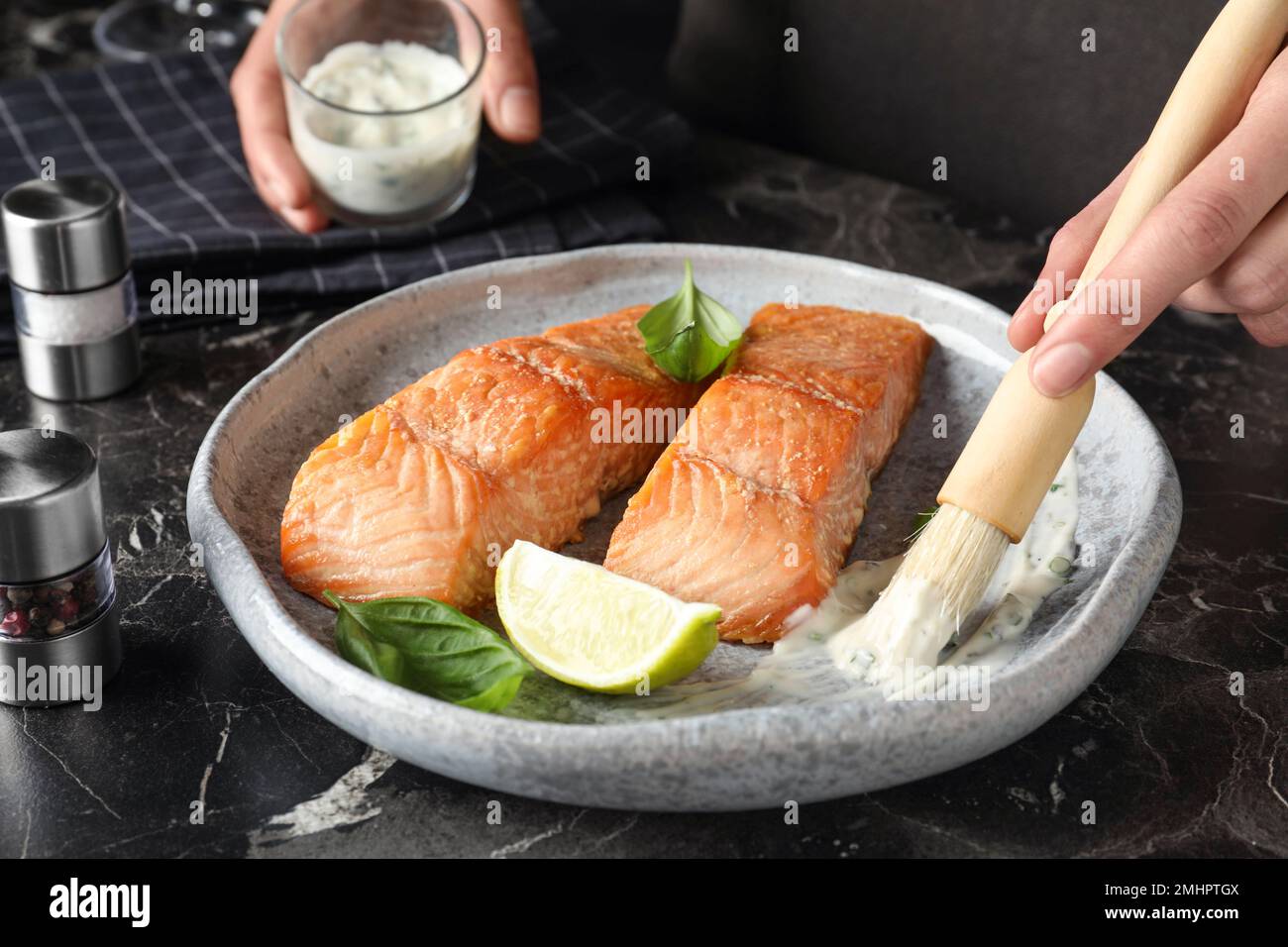 Female hands adding sauce fish hi-res stock photography and images - Alamy