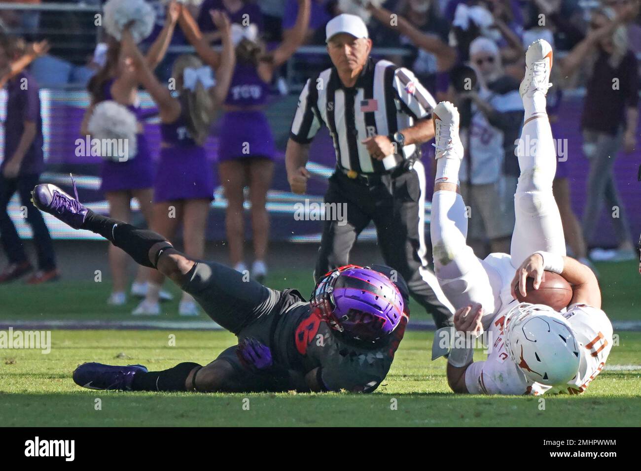 TCU safety Innis Gaines (6) upends Texas quarterback Sam Ehlinger (11) in  the second half of an NCAA college football game in Fort Worth, Texas,  Saturday, Oct. 26, 2019. (AP Photo/Louis DeLuca