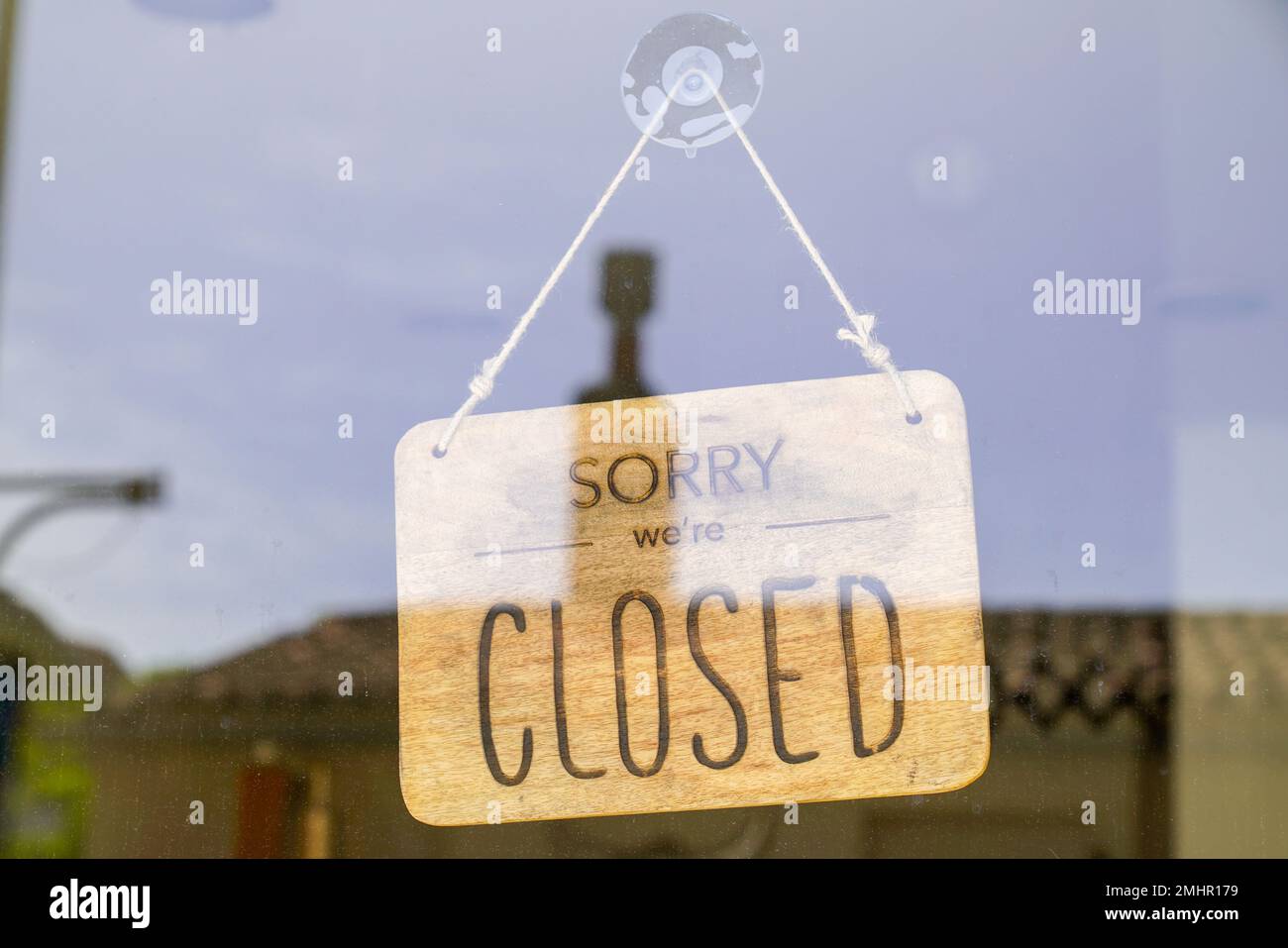 wooden sorry we are closed or open sign board wood on windows shop restaurant cafe store signboard Stock Photo