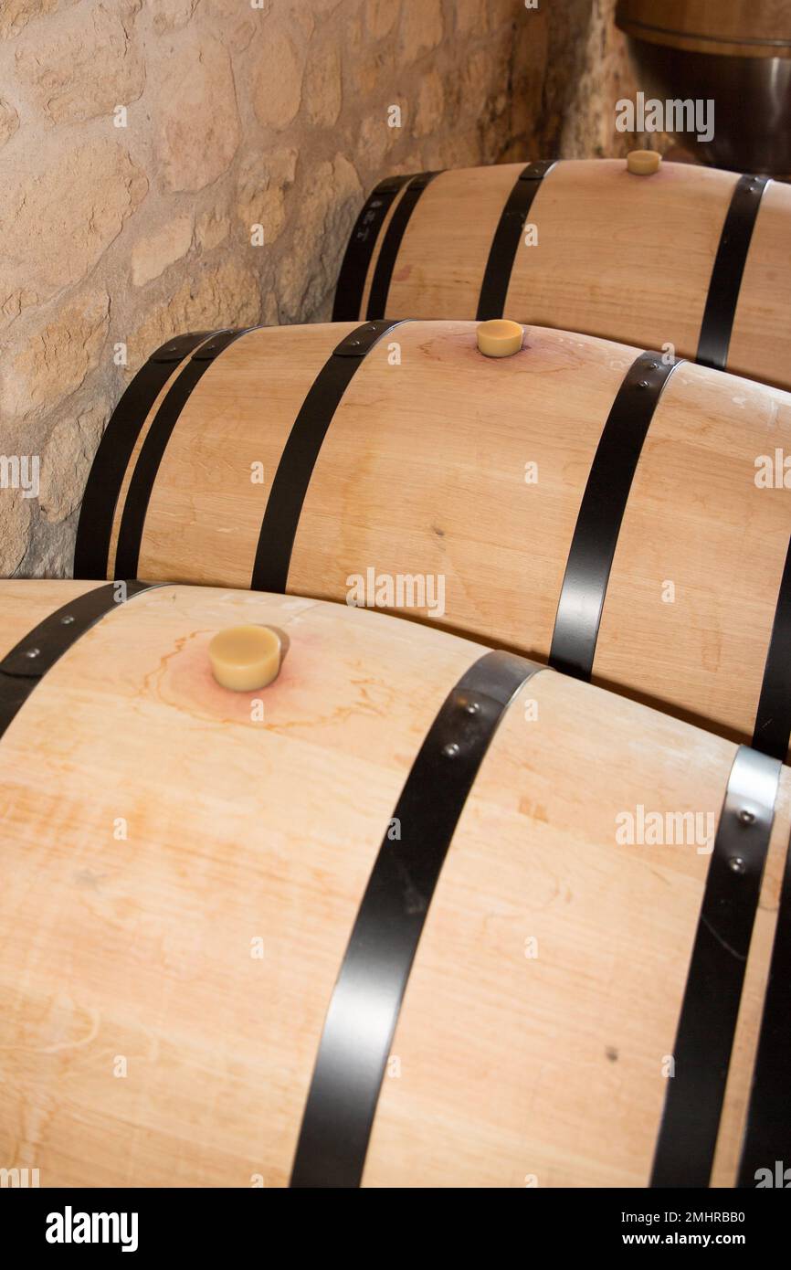 wine aging in barrels cellar wood bordeaux Stock Photo Alamy