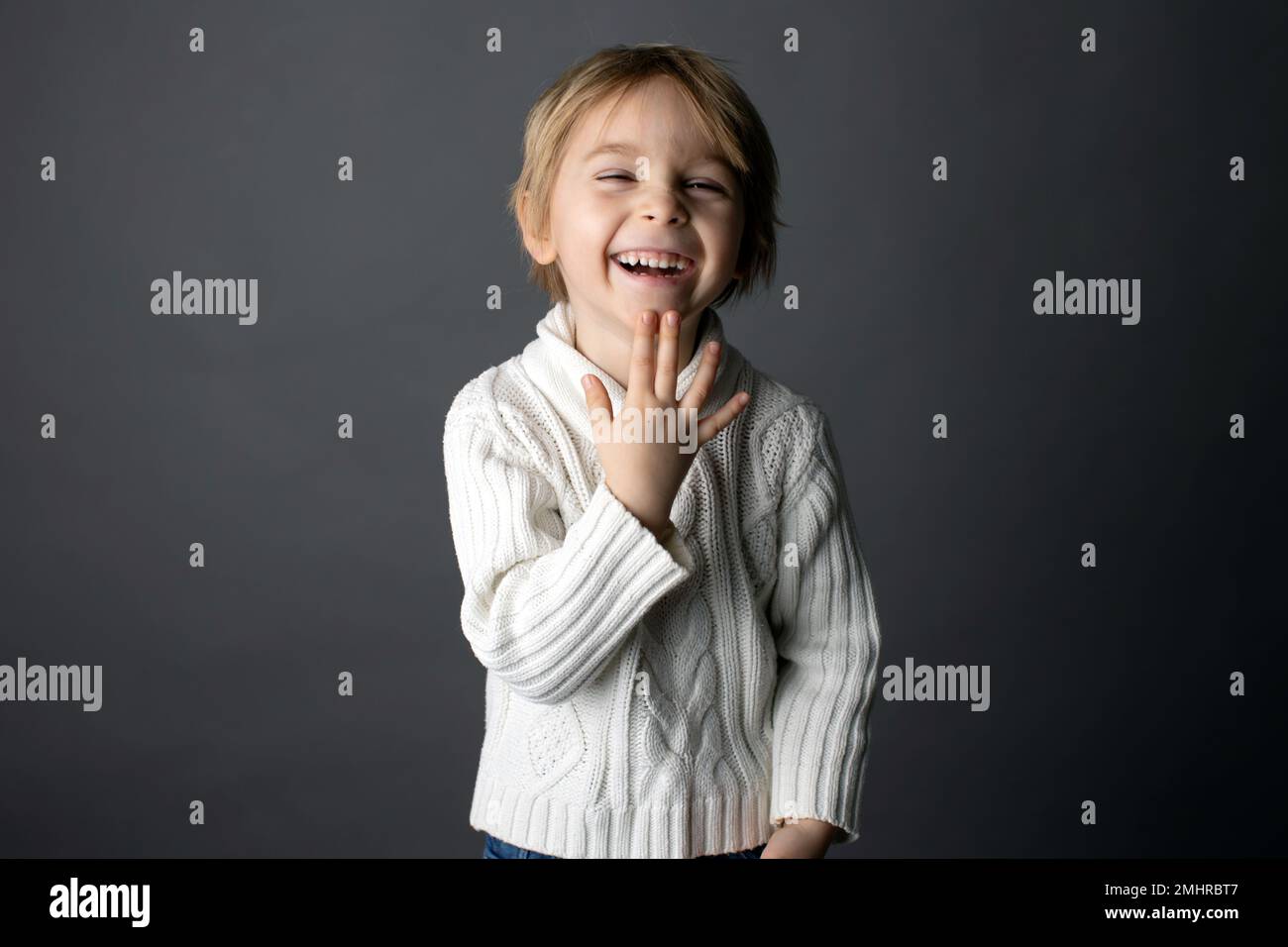 Cute little toddler boy, showing THANK YOU gesture in sign language on ...