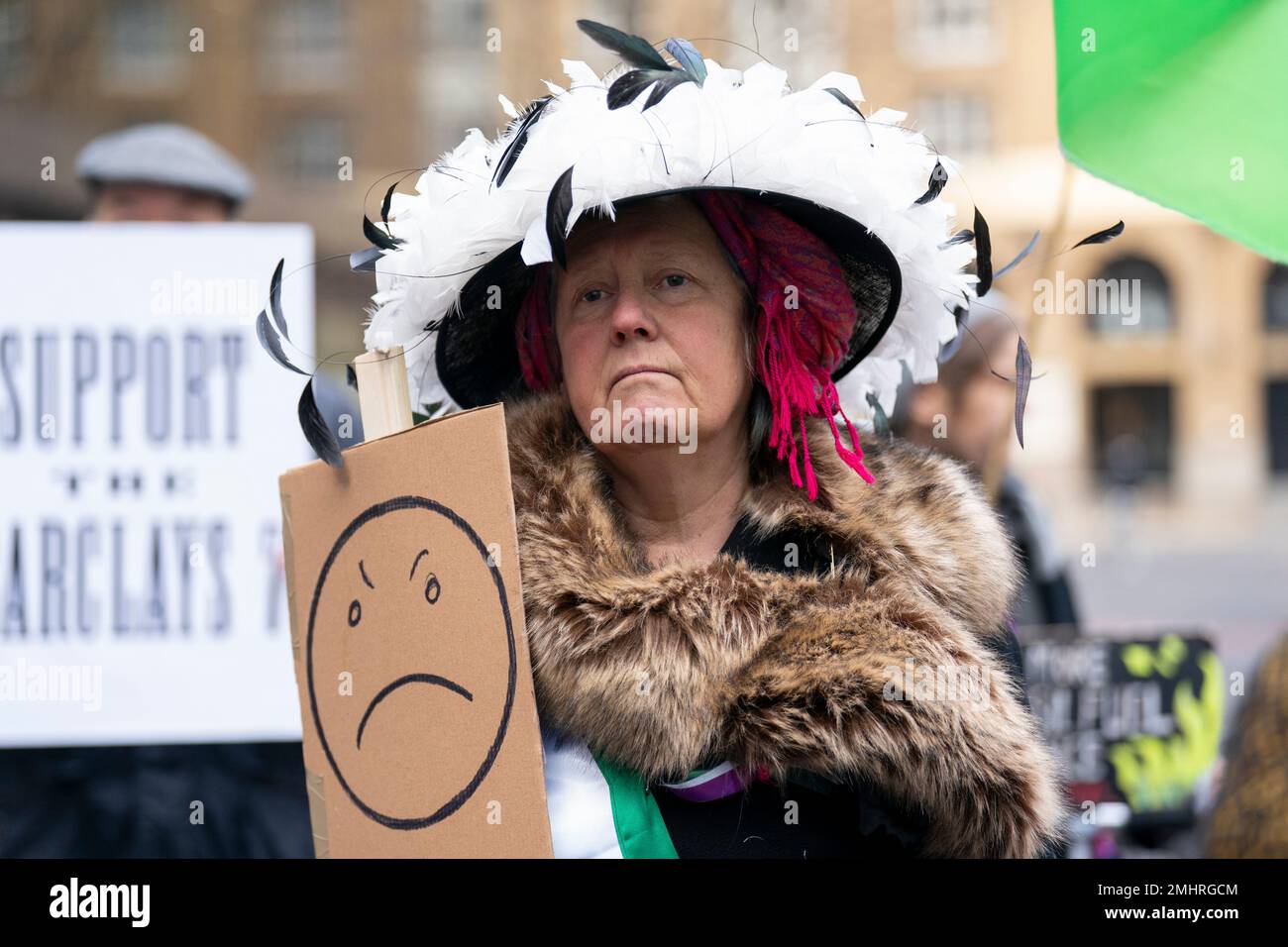 An activist dressed as a Suffragette protests outside Southwark Crown Court, London, where climate protesters Carol Wood, Sophie Cowen, Lucy Porter, Gabriella Ditton, Rosemary Webster and Zoe Cohen are appearing for sentencing after they were found guilty of causing almost £100,000 in damage for smashing glass windows at the London headquarters of Barclays bank. Picture date: Friday January 27, 2023. Stock Photo