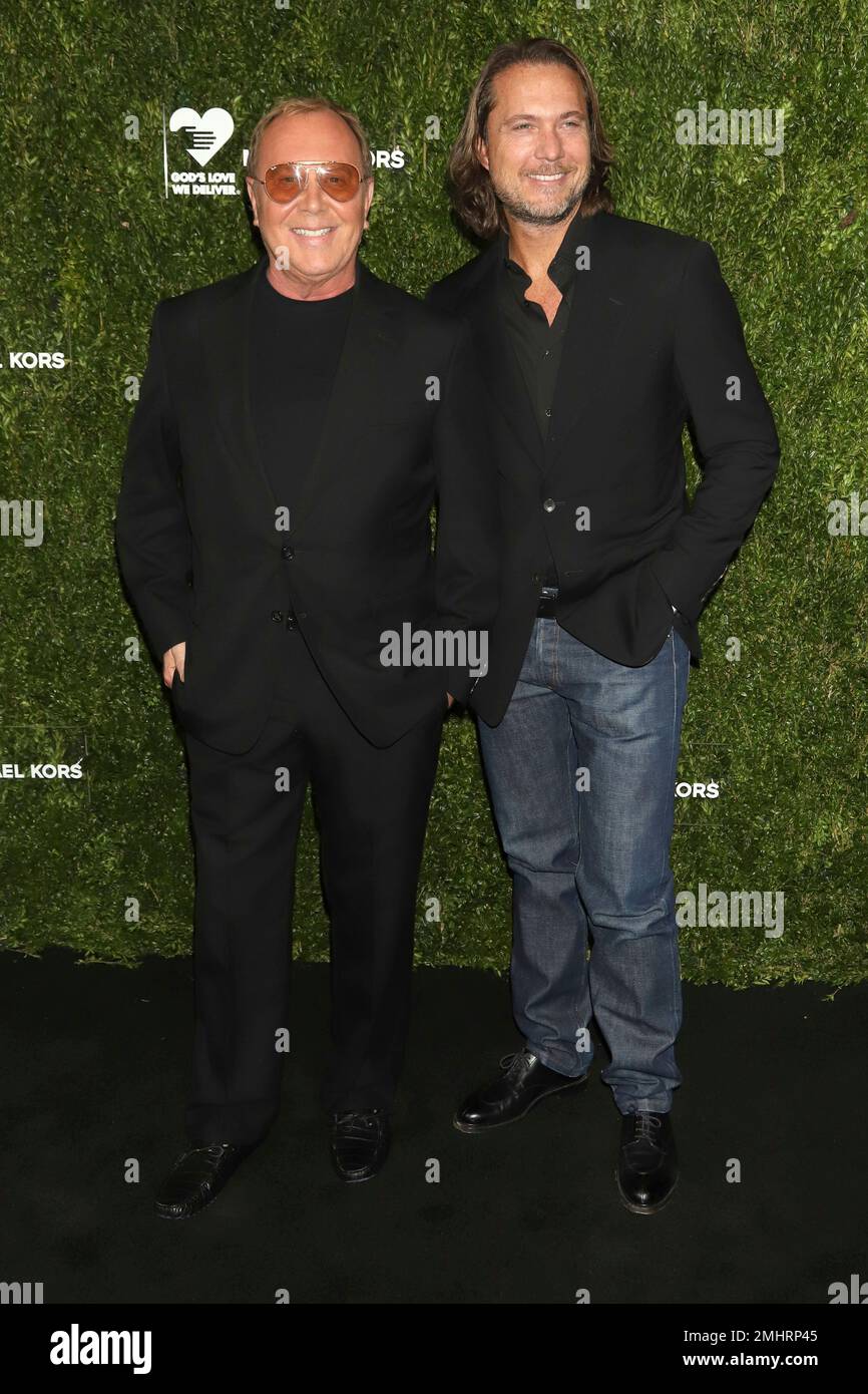 Michael Kors, left, and Lance LePere attend the God's Love We Deliver  Golden Heart Awards at Cipriani South Street on Monday, Oct. 21, 2019, in  New York. (Photo by Greg Allen/Invision/AP Stock