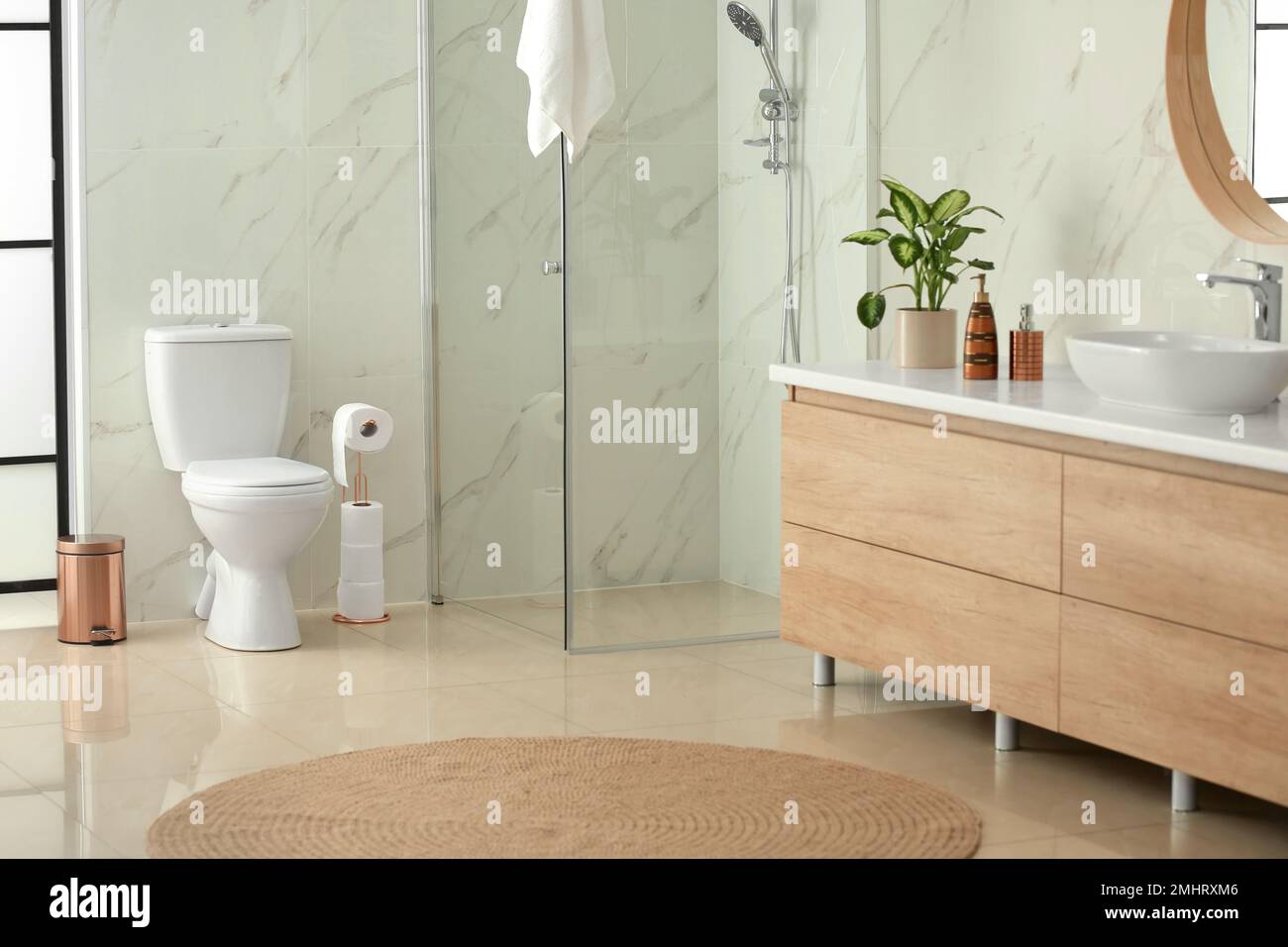 Interior of modern bathroom with toilet bowl Stock Photo - Alamy